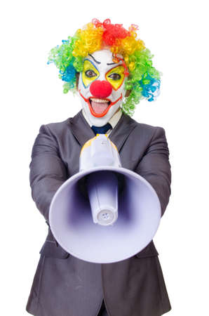 Businessman clown with loudspeaker on whiteの写真素材