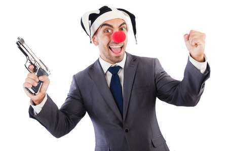 Businessman clown with gun isolated on whiteの写真素材