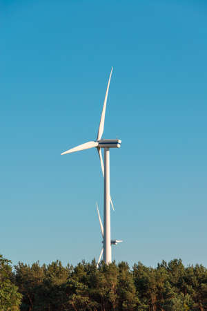 Wind mills during bright summer day