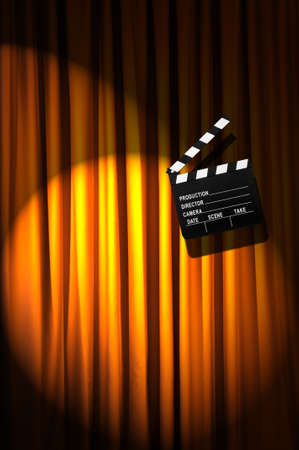 Movie clapper board against curtainの写真素材