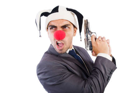 Businessman clown with gun isolated on whiteの写真素材