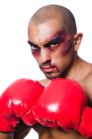 Badly beaten boxer isolated on whiteの写真素材