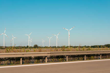 Wind mills during bright summer day