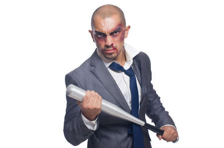 Badly bruised businessman with bat on white