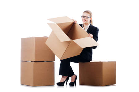 Businesswoman with boxes isolated on whiteの写真素材
