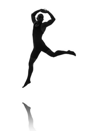 silhouette of male dancer isolated on whiteの写真素材