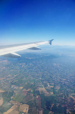Airplane wing out of windowの写真素材
