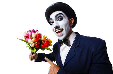 Man with flowers isolated on the whiteの写真素材