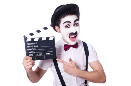 Man with movie clapper isolated on whiteの写真素材