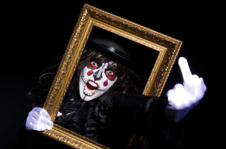 Monster with picture photo frame in dark room0