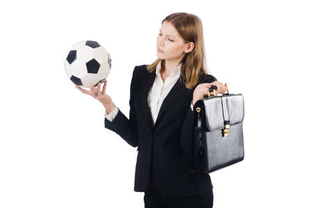 Businesswoman with football on whiteの写真素材