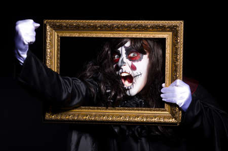 Monster with picture photo frame in dark room0