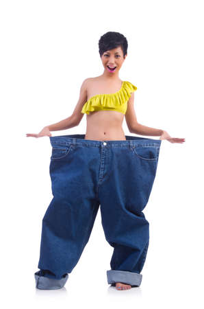 Woman in dieting concept with big jeansの写真素材
