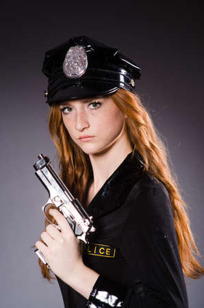 Redhead police office with gunの写真素材