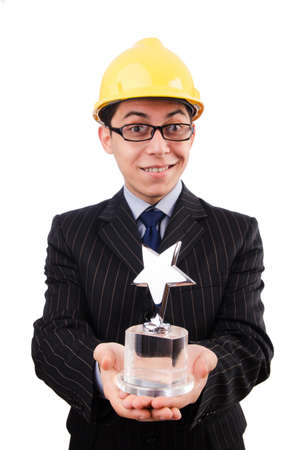 Funny guy with prize and hardhatの写真素材