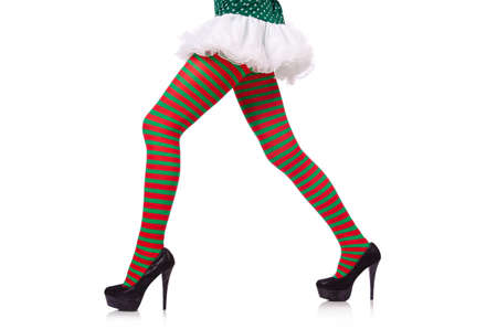 Woman legs in striped stockings on whiteの写真素材