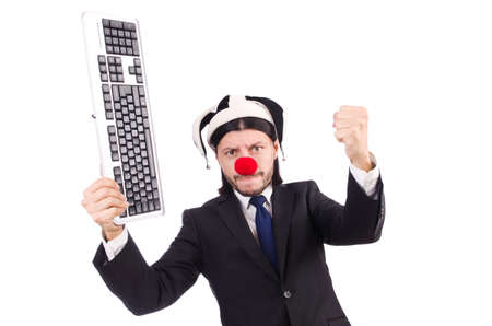 Funny clown with keyboard isolated on whiteの写真素材
