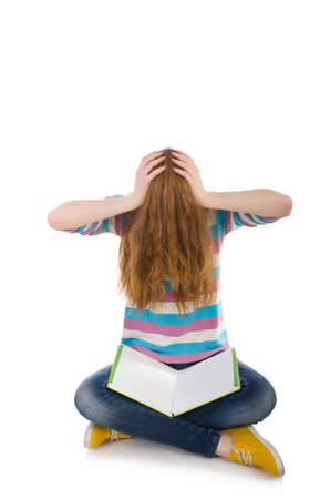 Young student with books isolated on whiteの写真素材