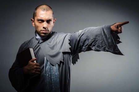 Young priest isolated on the whiteの写真素材