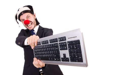 Funny clown with keyboard isolated on whiteの写真素材