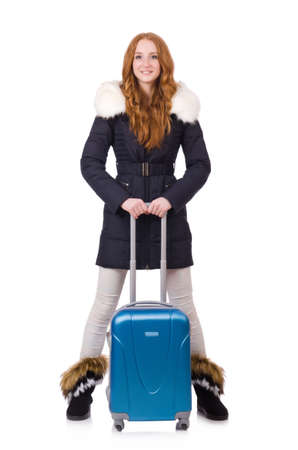 Woman with suitcase preparing for winter vacationの写真素材