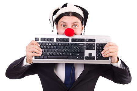 Funny clown with keyboard isolated on whiteの写真素材