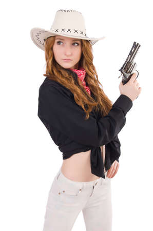 Young cowgirl with handgun isolated on whiteの写真素材