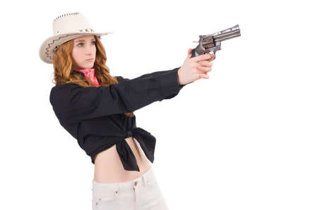 Young cowgirl with handgun isolated on whiteの写真素材