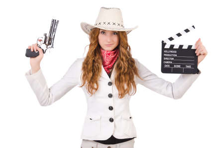 Young   cowgirl with gun  and movie board  isolated on whiteの写真素材