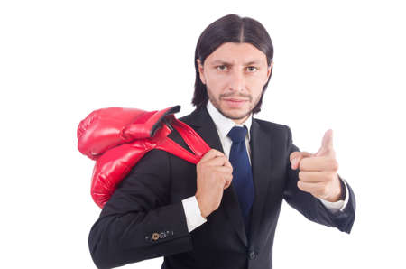 Businessman with boxing gloves on whiteの写真素材