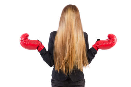 Woman businesswoman with boxing gloves on whiteの写真素材