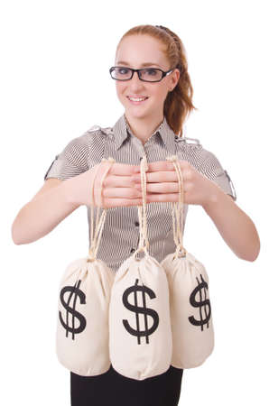 Young businesswoman with money sacks on whiteの写真素材