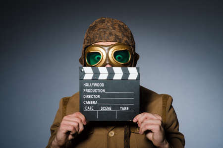 Funny pilot with goggles and helmet