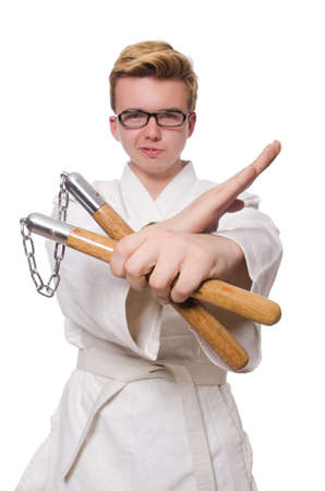Funny karate fighter with nunchucks on whiteの写真素材