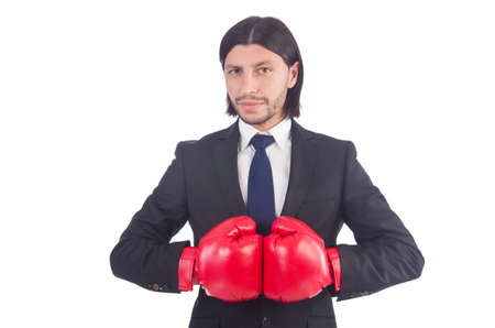 Businessman with boxing gloves on whiteの写真素材