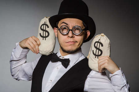 Man with sacks of moneyの写真素材