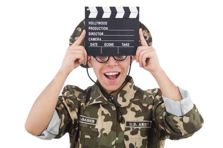 Funny soldier with movie board isolated on the whiteの写真素材