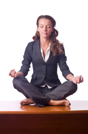 Woman meditating on the deskの写真素材