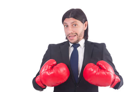 Businessman with boxing gloves on whiteの写真素材