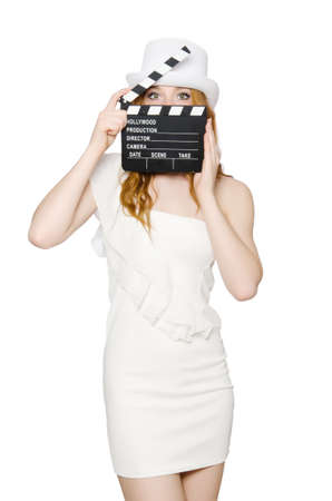 Young woman with movie board on whiteの写真素材