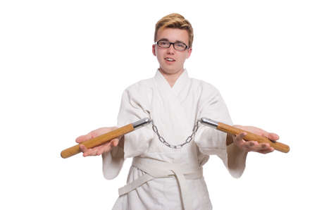 Funny karate fighter with nunchucks on whiteの写真素材
