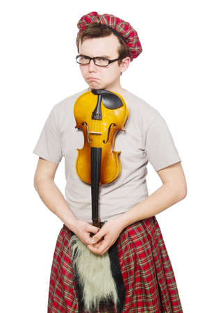 Funny scotsman with violin on whiteの写真素材
