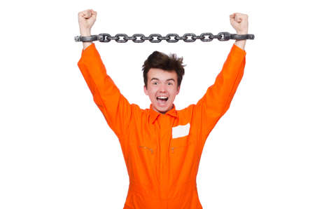 Young inmate with chains isolated on the whiteの写真素材