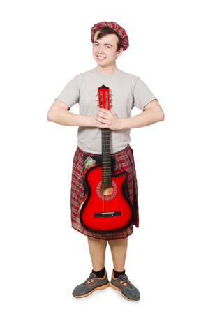 Scotsman playing guitar isolated on whiteの写真素材
