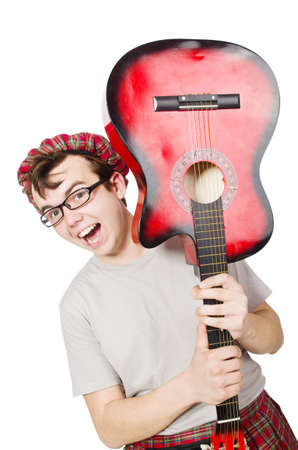 Scotsman playing guitar isolated on whiteの写真素材