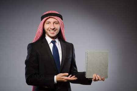 Arab student with book in education conceptの写真素材