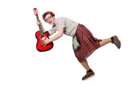 Scotsman playing guitar isolated on whiteの写真素材