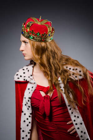 Queen in red dress in studioの写真素材