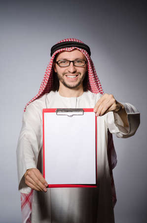 Arab man with paper binderの写真素材