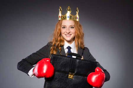 Woman boxer with crown and red glovesの写真素材